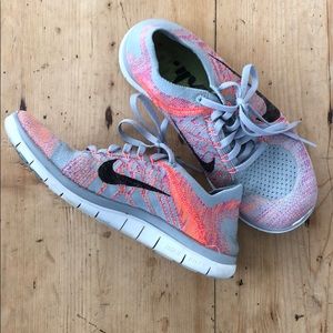 Grey and pink Nike Free